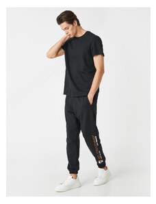 Koton Jogger Sweatpants with a skull print, pockets and a lace-up waist.