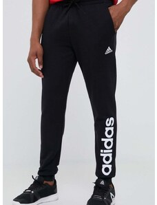 Bavlněné tepláky adidas černá barva, s potiskem