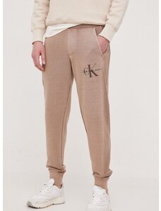 Bavlněné tepláky Calvin Klein Jeans hnědá barva