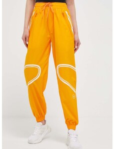 Tréninkové kalhoty adidas by Stella McCartney TruePace oranžová barva, s potiskem