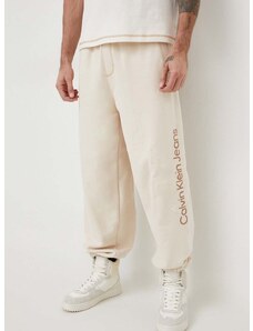 Bavlněné tepláky Calvin Klein Jeans béžová barva, s aplikací, J30J324953