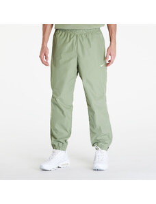 Pánské šusťákové kalhoty Nike x NOCTA Woven Track Pants Oil Green/ Light Liquid Lime