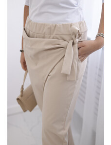 K-Fashion Kalhoty zavazované s asymetrickým předním dílem béžový
