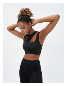 Koton Sports Bra. Padded, Non-wired Sports Bra with Window Detail in the Back and Straps.