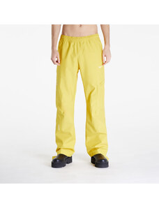 Pánské šusťákové kalhoty Nike x NOCTA x L'ART DE L’AUTOMOBILE Men's Tech Pants Vivid Sulfur/ Sail