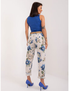Fashionhunters Světle béžové látkové kalhoty s květinovým potiskem