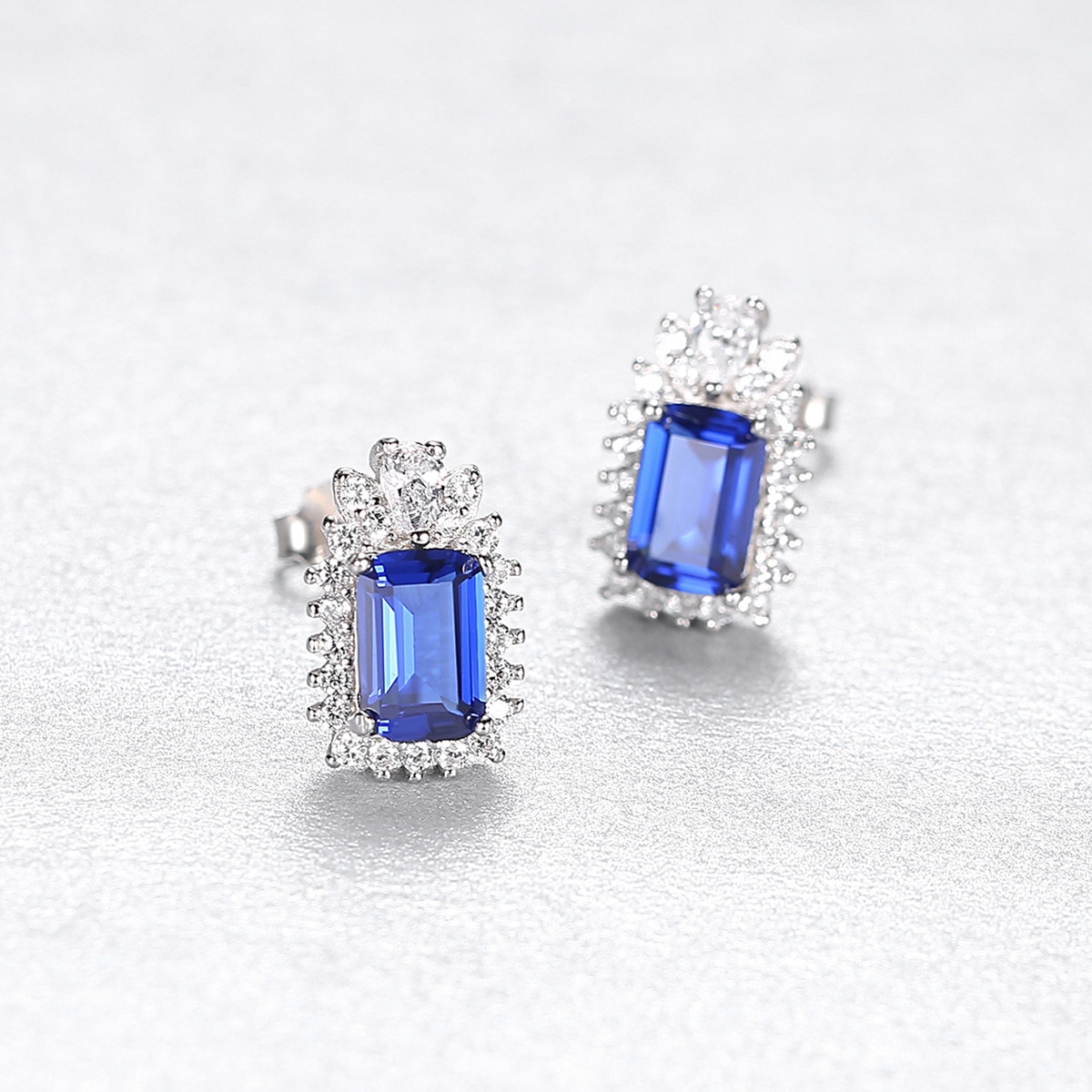 Stříbrné náušnice s obdélníkovými modrými a čirými zirkony - Meucci SYE160