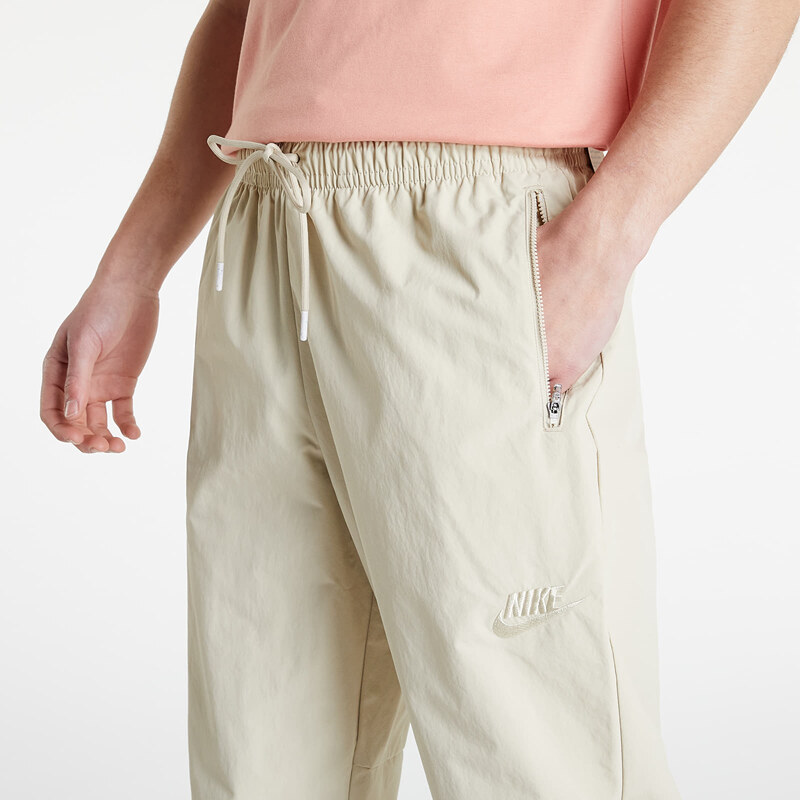 Pánské šusťákové kalhoty Nike Sportswear Revival Woven Track Pants Rattan