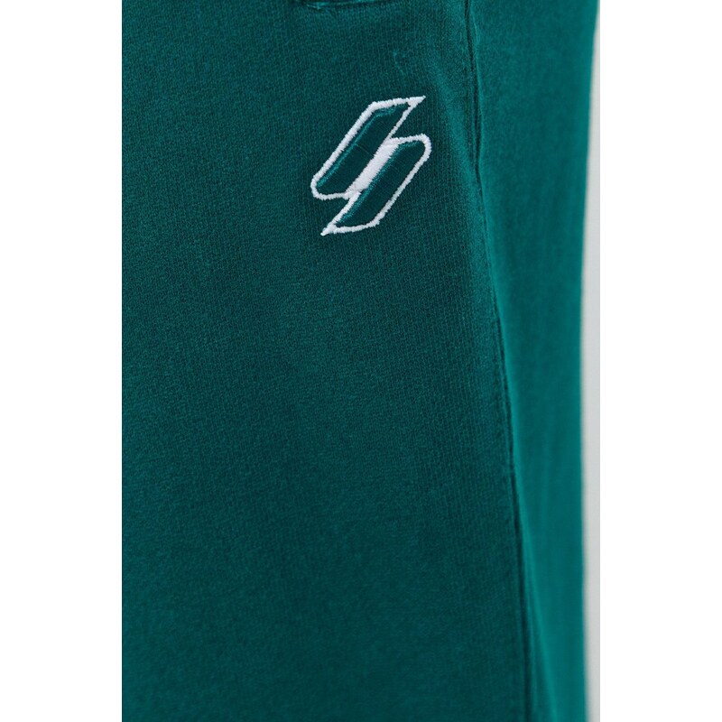 Bavlněné tepláky Superdry zelená barva