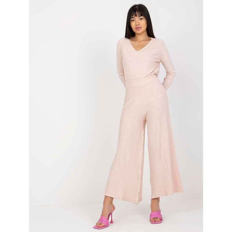 Fashionhunters Světle růžové pletené kalhoty se širokou nohavicí