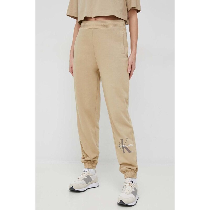 Tepláky Calvin Klein Jeans dámské, béžová barva, s potiskem