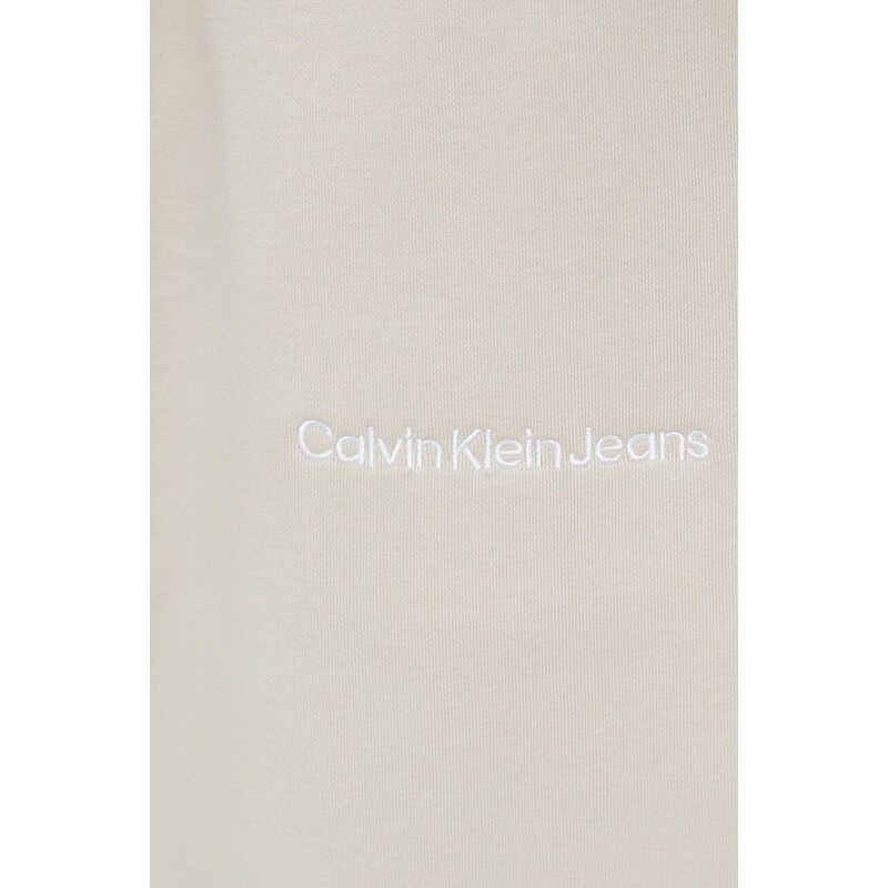 Tepláky Calvin Klein Jeans béžová barva, s aplikací