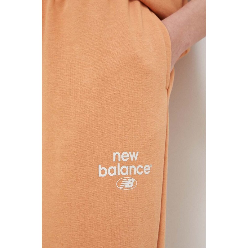 Tepláky New Balance oranžová barva, s potiskem, WP31508SEI-SEI