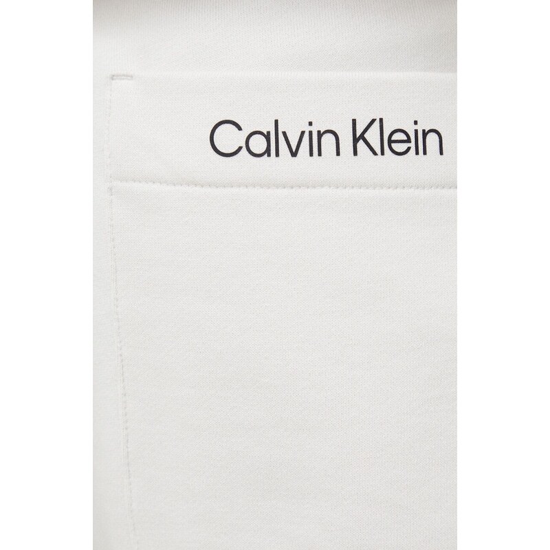 Kraťasy Calvin Klein Performance CK Athletic pánské, béžová barva