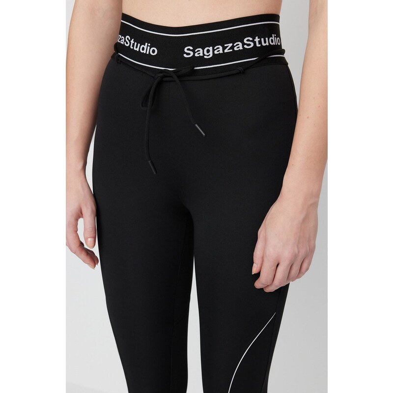 Trendyol X Sagaza Studio Black Stretchy Sports Tights with Piping Detailed and Push-Up Stitching.