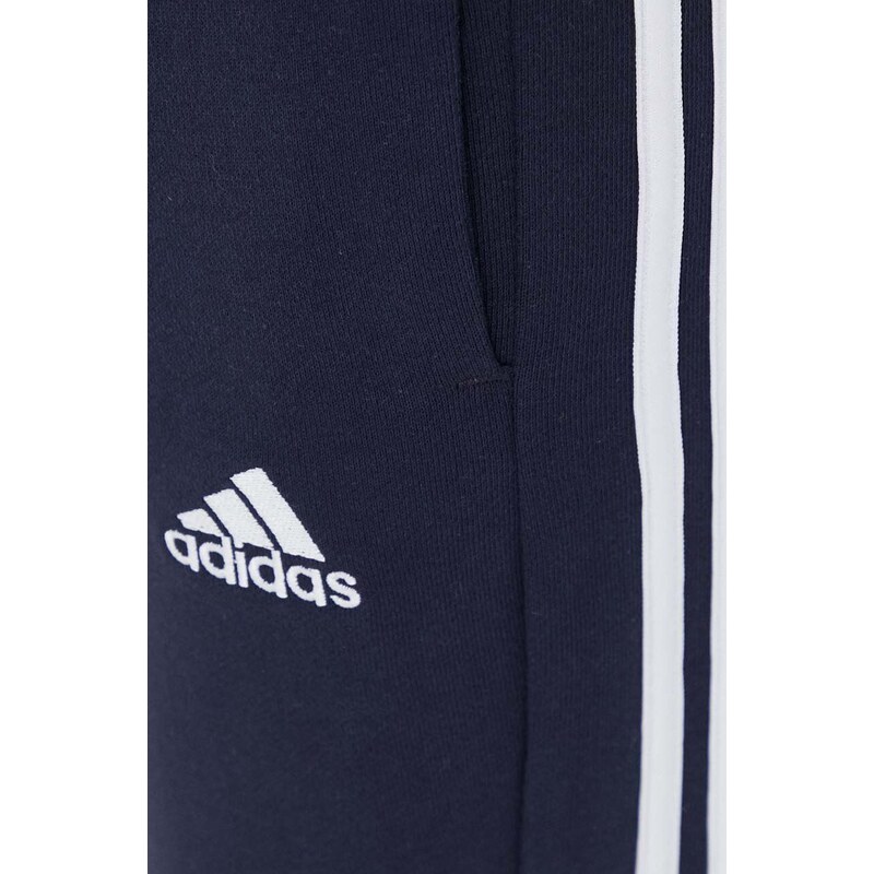 Bavlněné tepláky adidas tmavomodrá barva, s aplikací