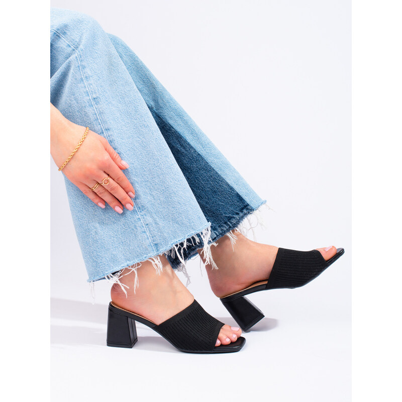 Textile womens black flip-flops on the Shelvt post