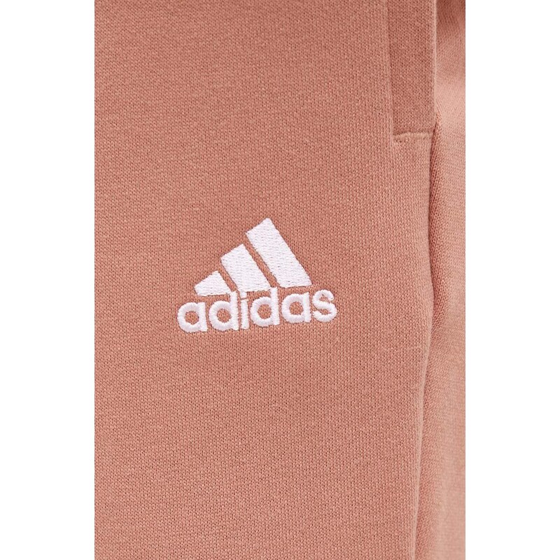 Bavlněné tepláky adidas oranžová barva