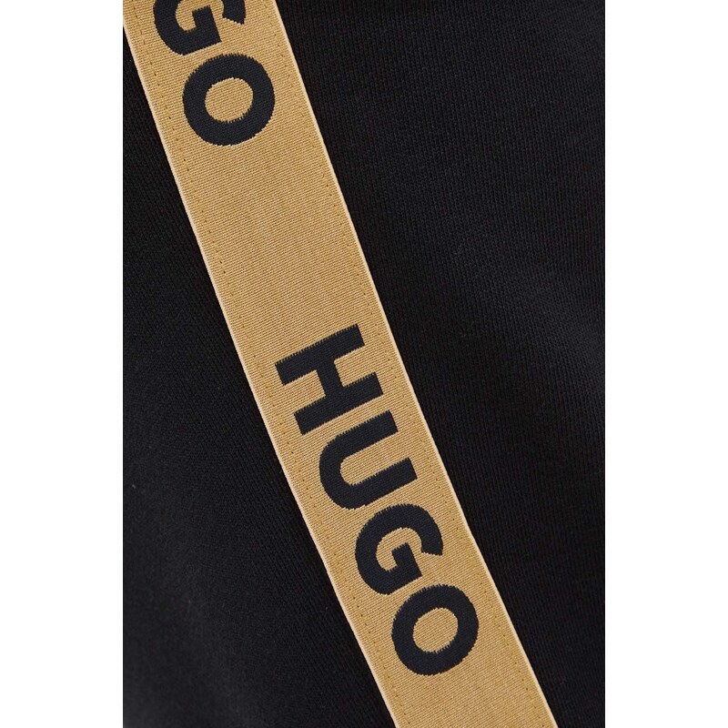 Bavlněné kalhoty HUGO černá barva, s aplikací