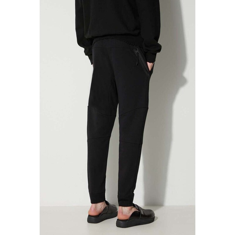 Bavlněné tepláky C.P. Company DIAGONAL RAISED FLEECE ZIPPED TRACK PANTS černá barva, 15CMSP084A005086W