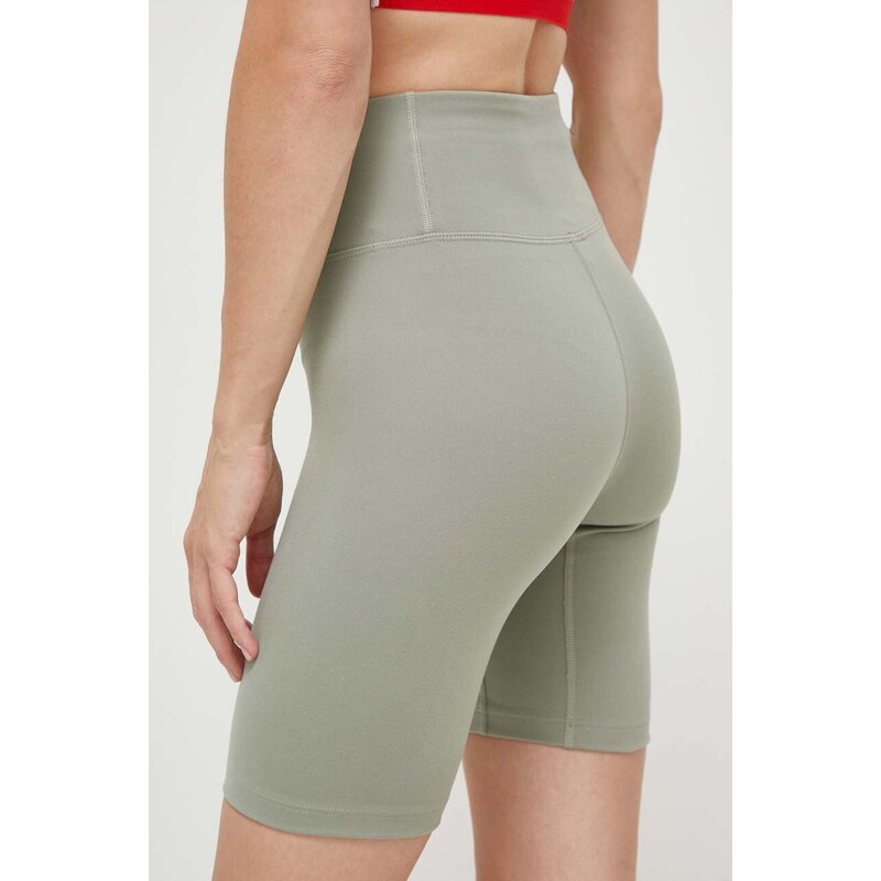 Tréninkové šortky Under Armour Motion zelená barva, hladké, high waist