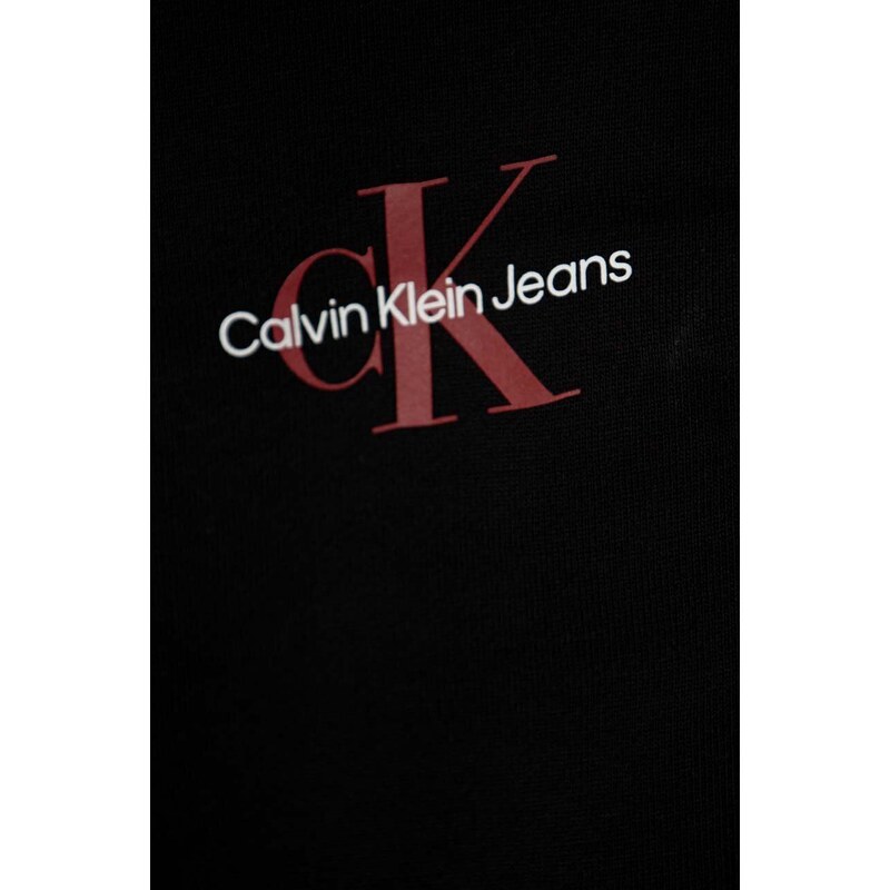 Dětské bavlněné tepláky Calvin Klein Jeans černá barva, s potiskem