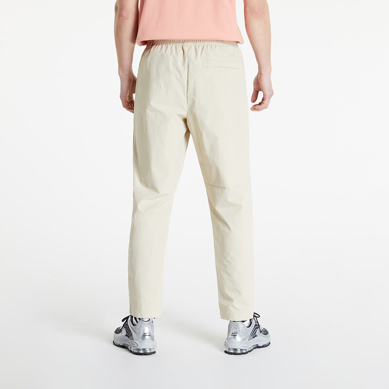 Pánské šusťákové kalhoty Nike Sportswear Revival Woven Track Pants Rattan