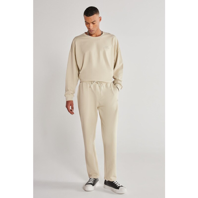 AC&Co / Altınyıldız Classics Unisex Beige Standard Fit Normal Cut, Flexible Cotton Sweatpants with Pockets.