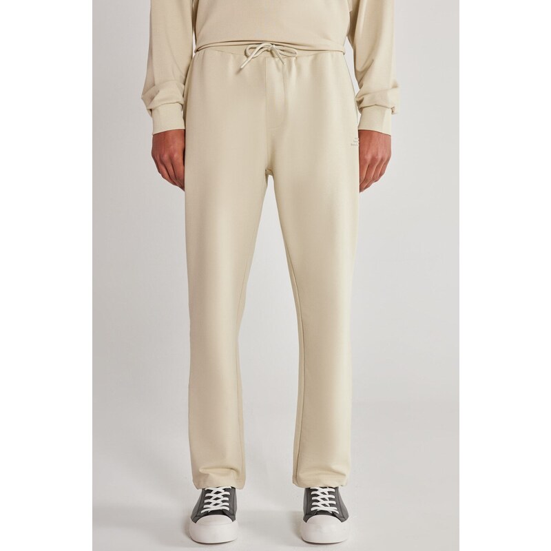 AC&Co / Altınyıldız Classics Unisex Beige Standard Fit Normal Cut, Flexible Cotton Sweatpants with Pockets.