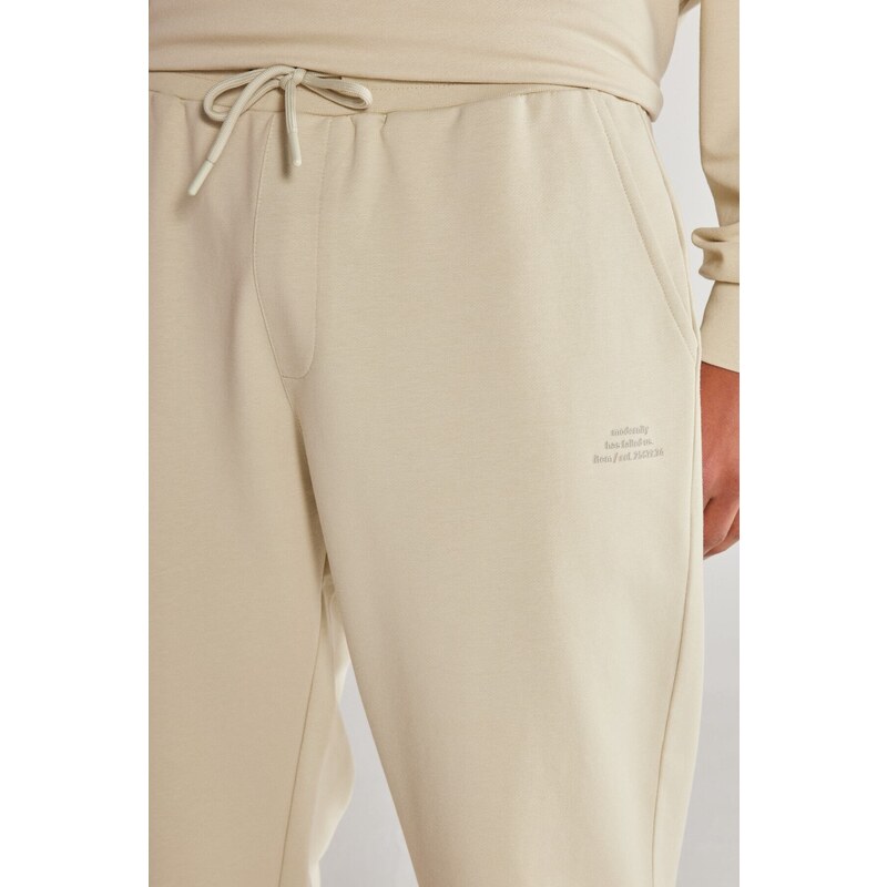 AC&Co / Altınyıldız Classics Unisex Beige Standard Fit Normal Cut, Flexible Cotton Sweatpants with Pockets.