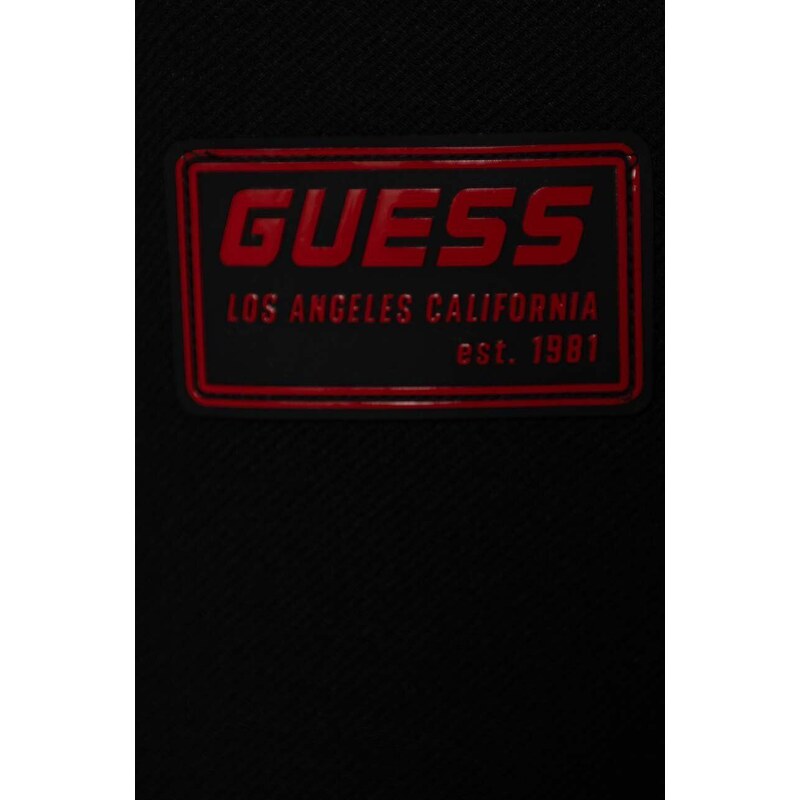 Dětské tepláky Guess černá barva, s aplikací