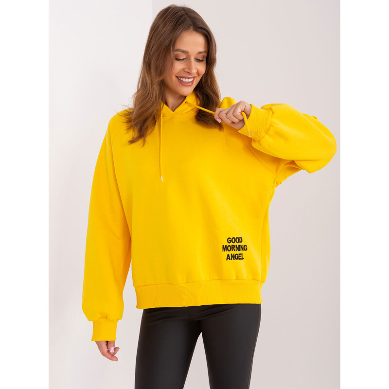Fashionhunters Žlutá zateplená oversize mikina s kapucí a nápisem