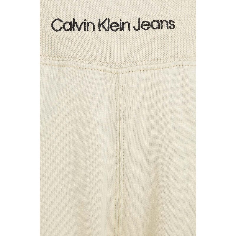 Dětské tepláky Calvin Klein Jeans béžová barva, hladké