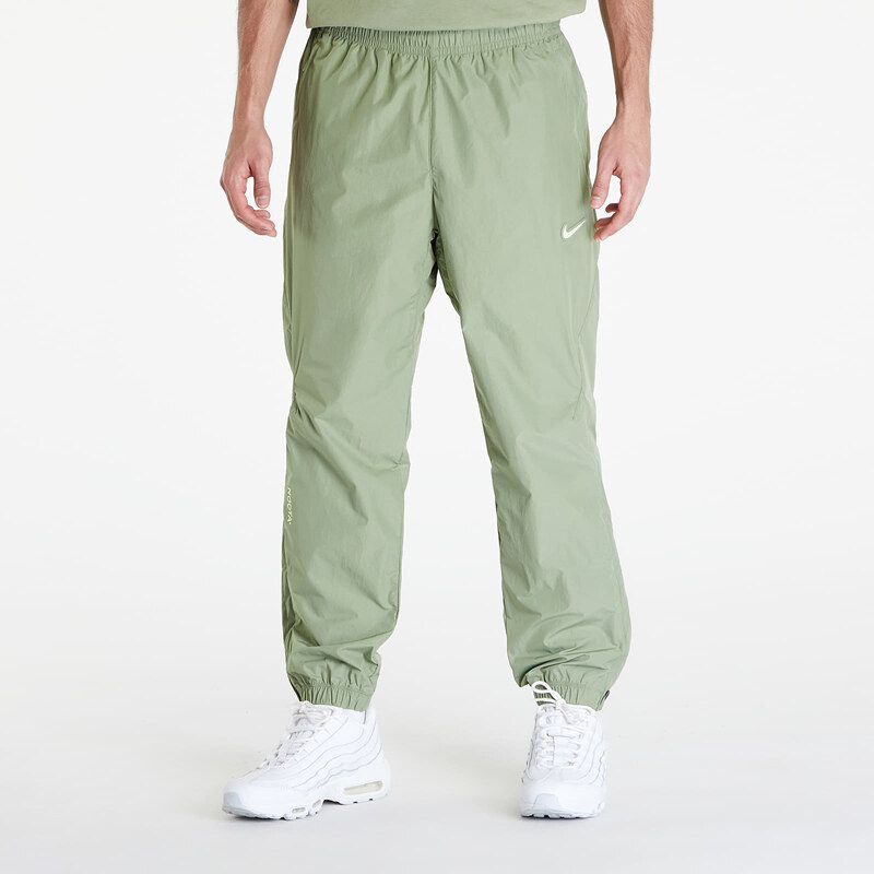 Pánské šusťákové kalhoty Nike x NOCTA Woven Track Pants Oil Green/ Light Liquid Lime