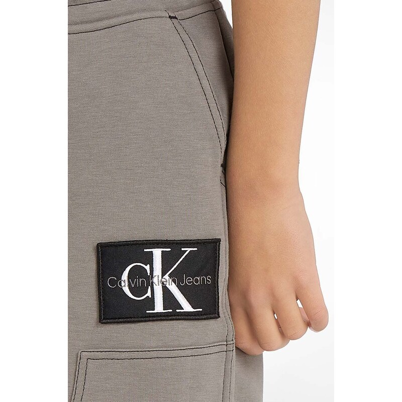 Dětské tepláky Calvin Klein Jeans šedá barva, hladké