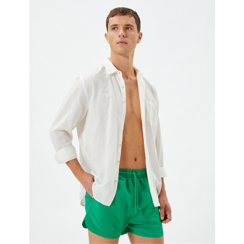 Koton Swimsuit Shorts Short waist with a tie-down pocket.