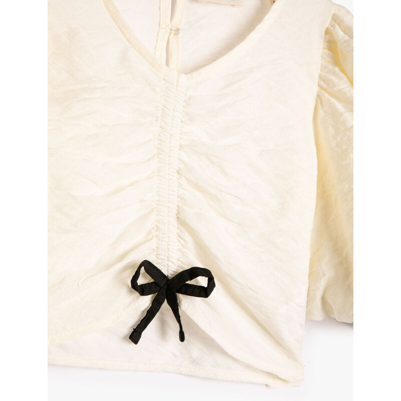 Koton Viscose Fabric V-neck with Short Puffy Balloon Sleeves In The Front Of The Blouse.
