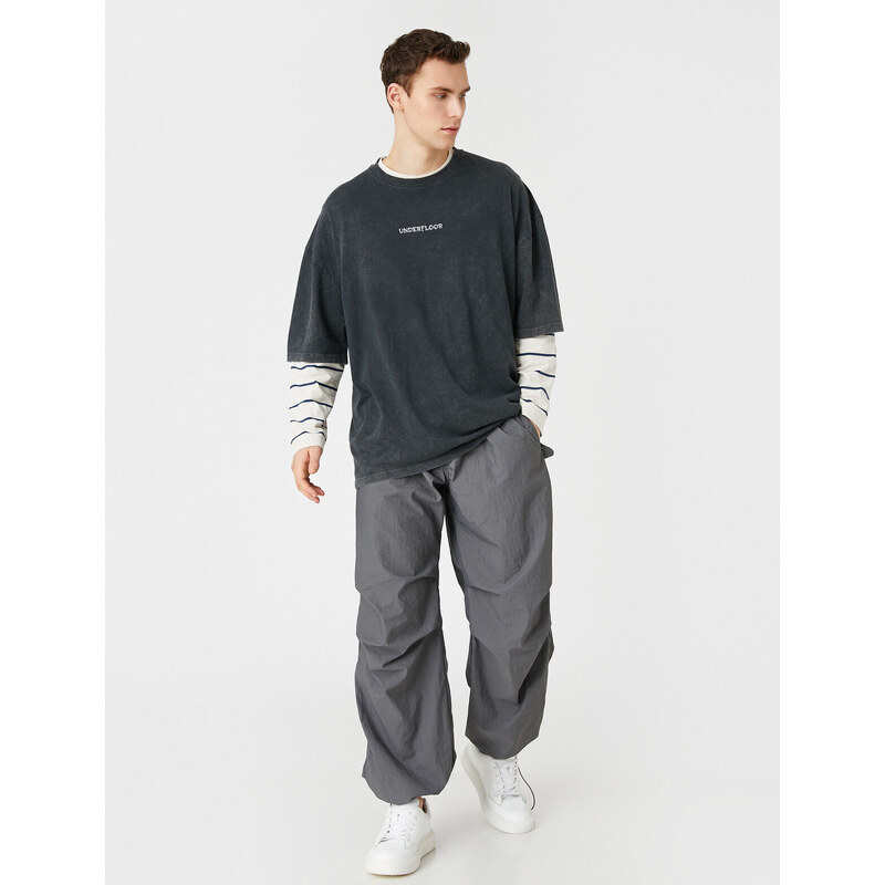 Koton Parachute Trousers with a loose fit, lacing at the waist, and elasticated legs with a pocket detail.