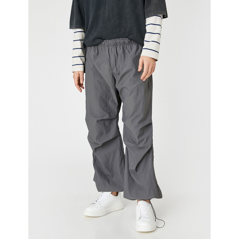 Koton Parachute Trousers with a loose fit, lacing at the waist, and elasticated legs with a pocket detail.