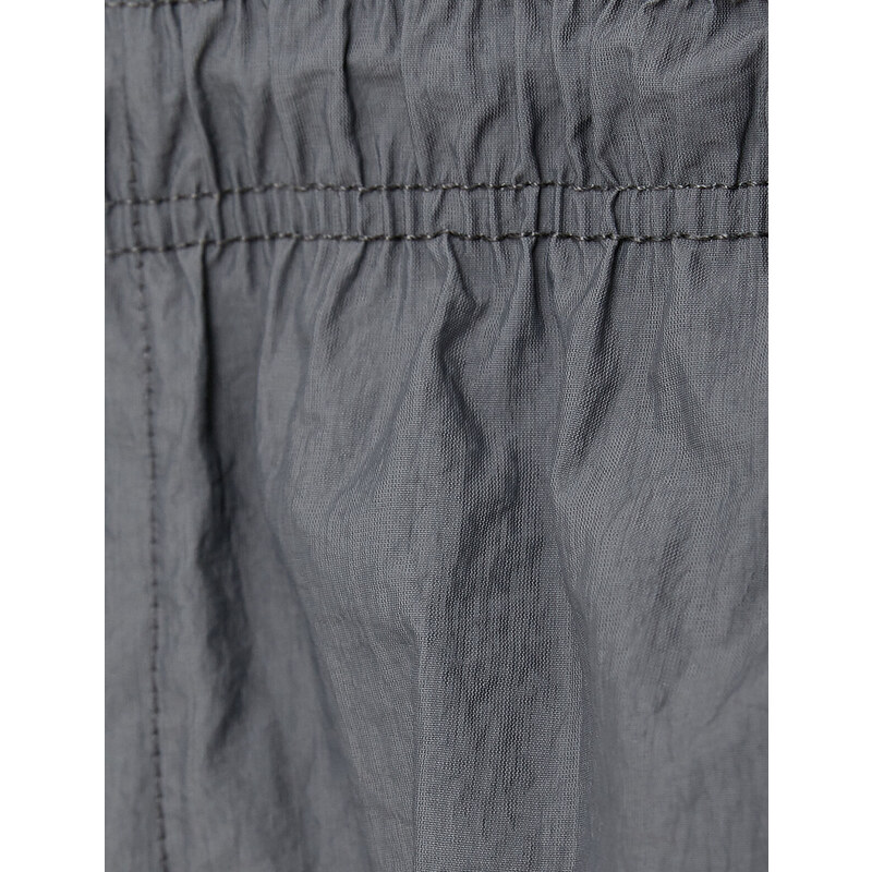 Koton Parachute Trousers with a loose fit, lacing at the waist, and elasticated legs with a pocket detail.