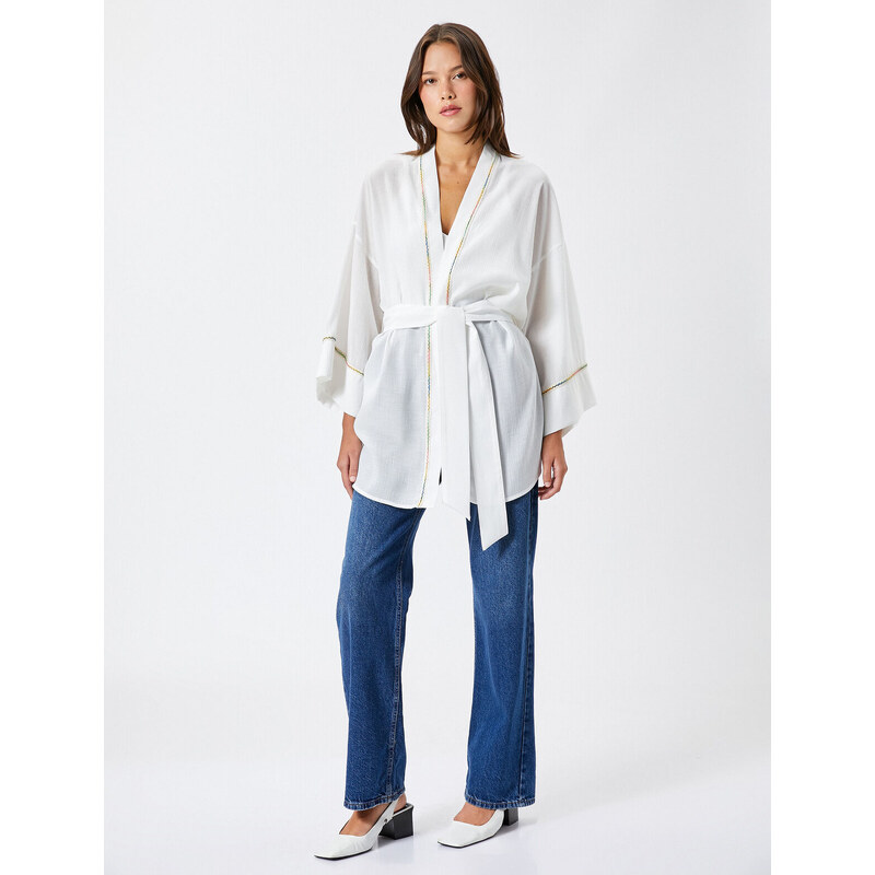 Koton The Belted Waist Kimono has a loose fit.