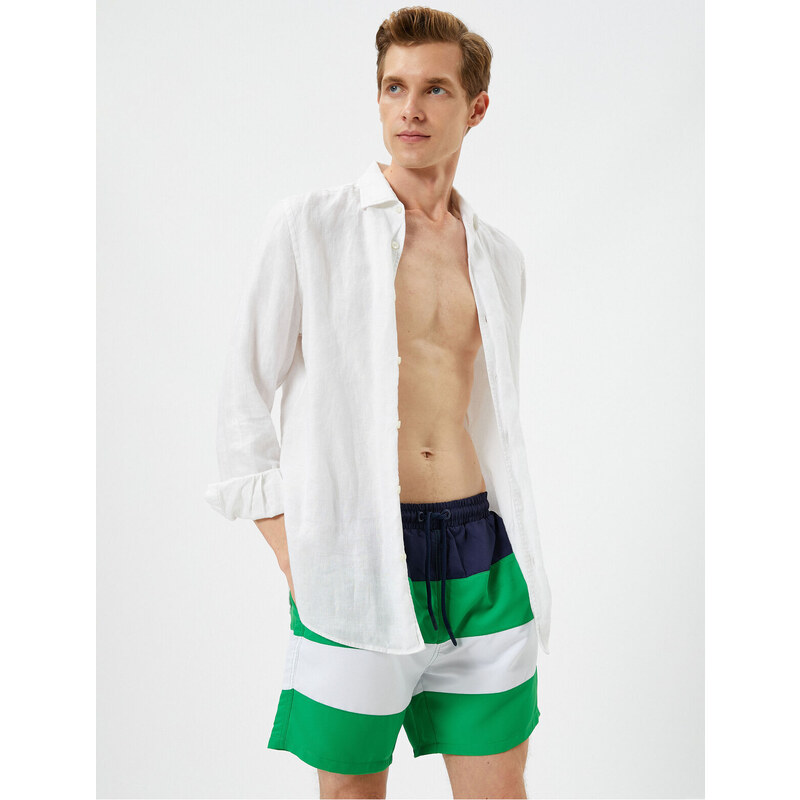 Koton Marine Shorts with Color Block with a drawstring waist and pocket.