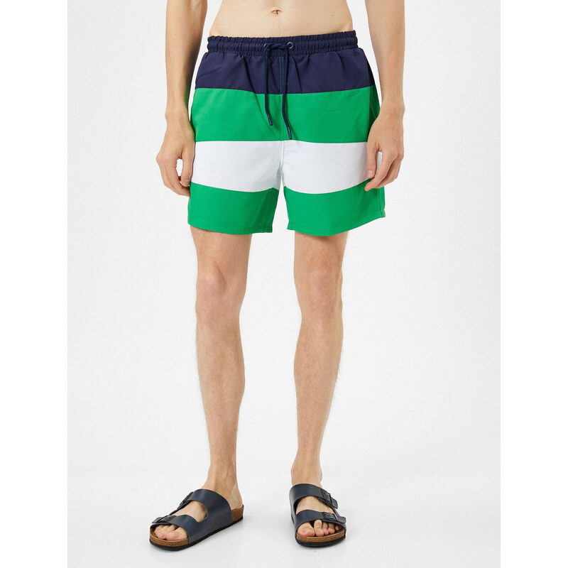 Koton Marine Shorts with Color Block with a drawstring waist and pocket.