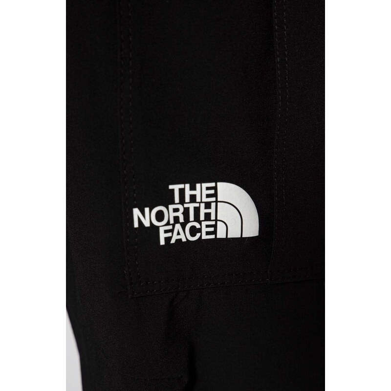 Dětské tepláky The North Face WOVEN CARGO PANT černá barva, hladké