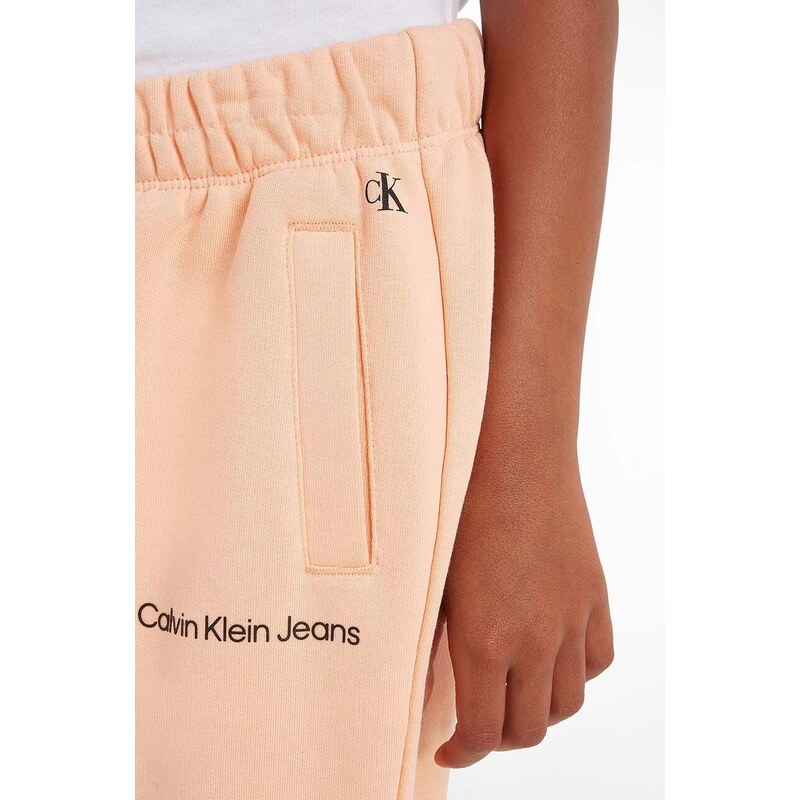 Dětské tepláky Calvin Klein Jeans oranžová barva, hladké