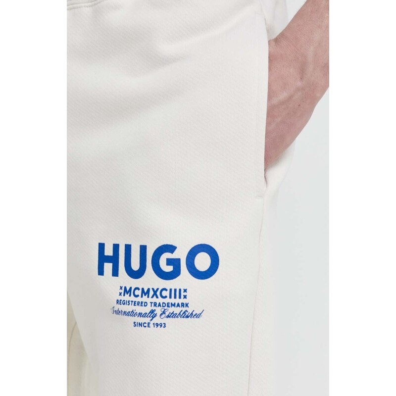 Bavlněné tepláky Hugo Blue béžová barva, s potiskem