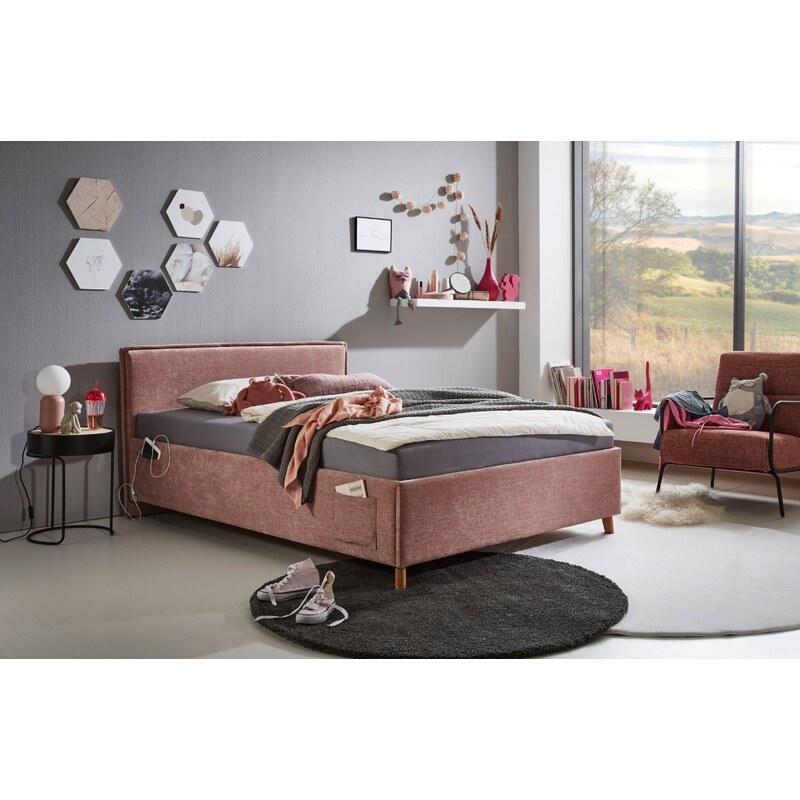 Růžová čalouněná postel Meise Möbel Fun 140 x 200 cm s úložným prostorem