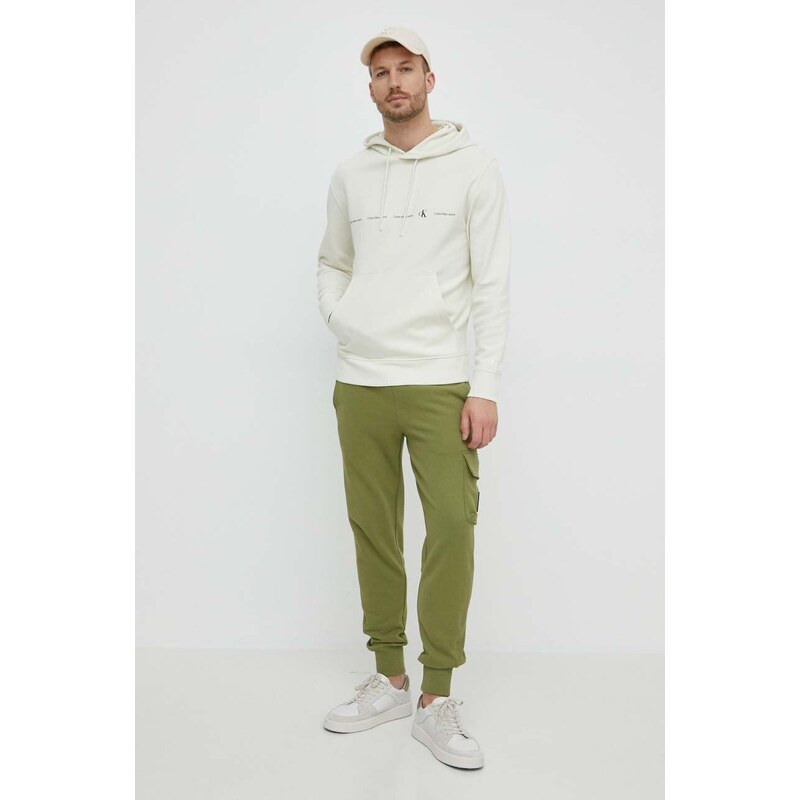 Bavlněné tepláky Calvin Klein Jeans zelená barva