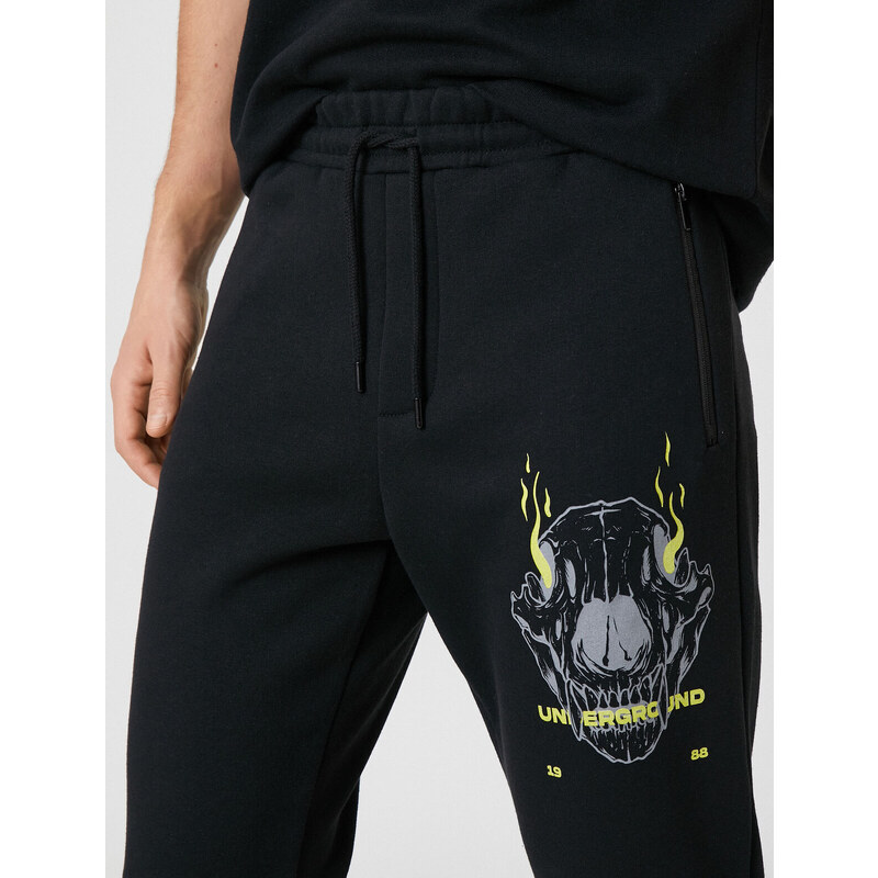 Koton Jogger Sweatpants with a skull print, zippered pockets, Lace-Up Waist.