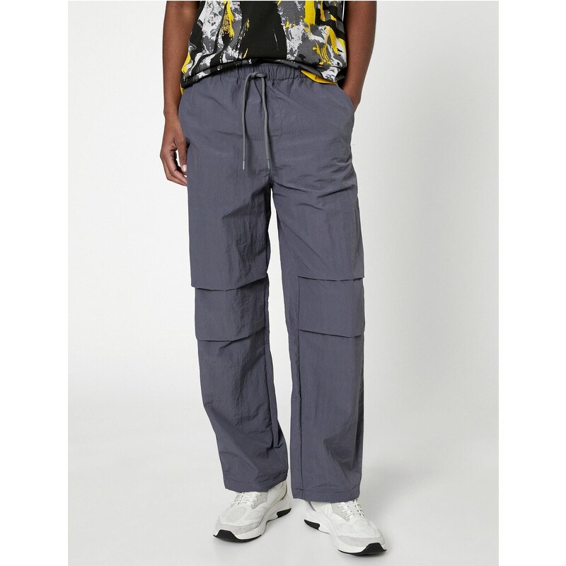 Koton Parachute Trousers with a loose fit, lacing at the waist, and elasticated legs with a pocket detail.